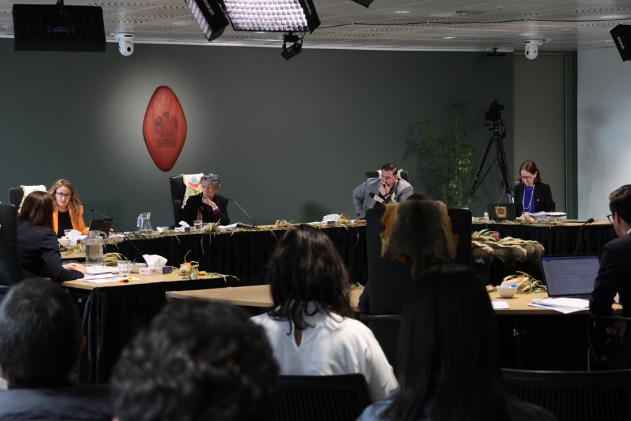 Yoorrook Commissioners questioning a witness in-front of a crowd in the Yoorrook hearing room. L-R Deputy Chair Sue-Anne Hunter, Chair Eleanor Bourke, Commissioner Travis Lovett and Commissioner Maggie Walter.