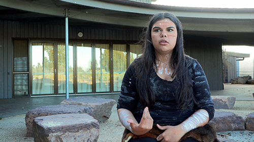 Gymea discussing what it feels like to be Aboriginal in Victorian schools outdoors at her school