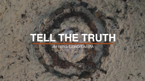 "Tell the Truth" on top of sand at a beach in Portland